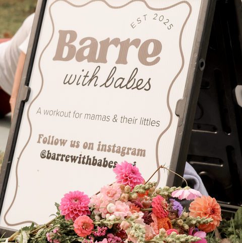 Mom participating in Barre with Babes fitness class surrounded by flowers at First Roots Farm in Oconomowoc Wisconsin