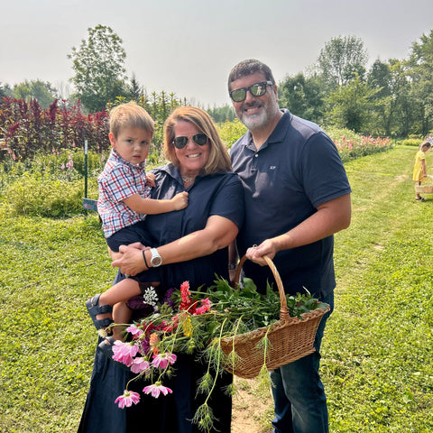 Family summer outing with Story Time and flowers at First Roots Farm.