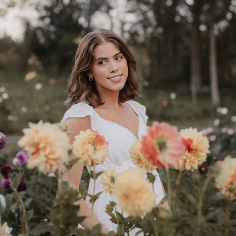Woman standing among flowers at First Roots Farm