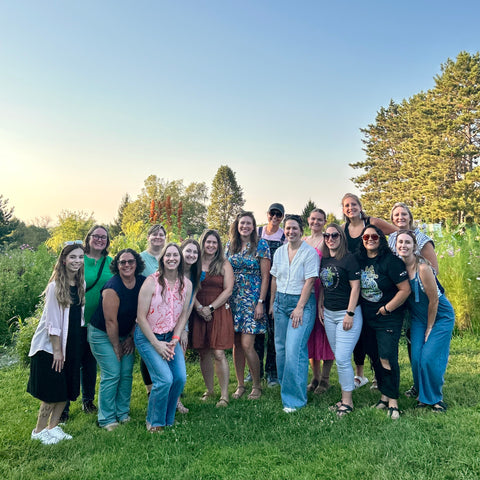 Group of people posing for a photo at First Roots Farm 