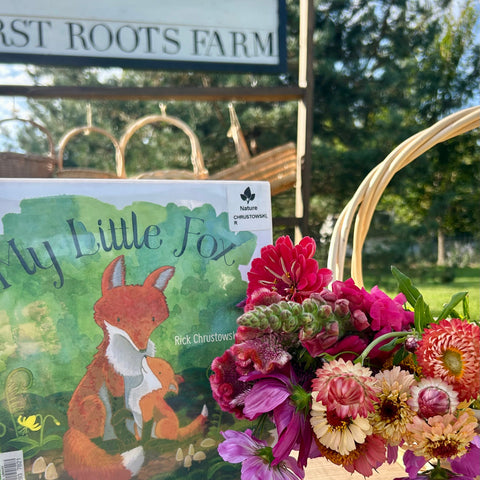 Children picking flowers after Story Time at First Roots Farm in Wisconsin.